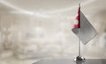 A small Nepal flag on an abstract blurry background Royalty Free Stock Photo