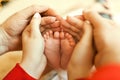 Baby`s little feet in lovely parental palms Royalty Free Stock Photo