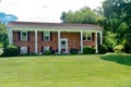 Small nice brick house with columns in a village near the atlantic ocean