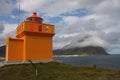 A small nice orange lighthouse Royalty Free Stock Photo