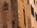 Small niche with the statue of the Virgin Mary in Trastevere district to Rome in Italy. Royalty Free Stock Photo