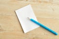 Small note pad with a blue pencil