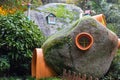 Small objects, window, door, stairs, chimney, glued to the rock to simulate a village Royalty Free Stock Photo