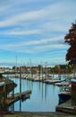 Small ocean marina in Maine, USA, with small pleasure boats parked on water Royalty Free Stock Photo