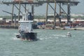 Small oil chemical tanker PANDA PG with blue hull, white superstructure and big rubber fender and pilot boat. Royalty Free Stock Photo