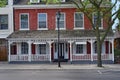 Old apartment building or hotel with full width porch