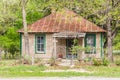 Small old bhouse with a rusted metal roof in the Texas hill country