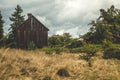 Small, old, brown barn in the countryside Royalty Free Stock Photo