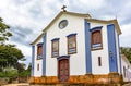 Small and old church and crucifix in colonial architecture Royalty Free Stock Photo