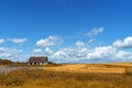 Small old dilapidated house on the field Royalty Free Stock Photo