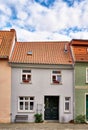 Small old house with a sloping shingle roof in the old town of Wismar