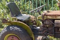 A small old rusted tractor