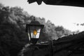 Small old and vintage metal lantern, street lamp. Black and white image. Royalty Free Stock Photo