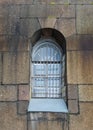 A small old window in the stone thick wall of the fortress Royalty Free Stock Photo