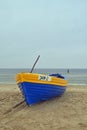 Old wooden clinker built fishing boat covered with glassfiber