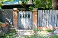 Small old wooden gates near residential homes Royalty Free Stock Photo