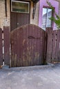 Small old wooden gates near residential homes Royalty Free Stock Photo