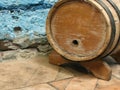 Small old wooden wine barrel on a wooden stand. Royalty Free Stock Photo