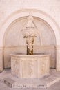 The small Onofrio fountain designed by the Italian architect Onofrio di Giordano della Cava at Stradun, the large street