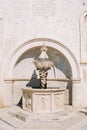 Small Onofrio Fountain near an ancient building. Dubrovnik, Croatia