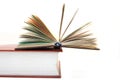 The small open book lays on big textbook Royalty Free Stock Photo