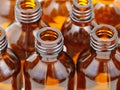 Small open brown glass pharmacy bottles close up