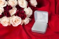 A Small Open Empty Ring Box with Bouquet of Roses