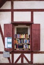A small open library during the corona pandemic in Augsburg offers books in a historic half-timbered house at an open window