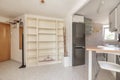 Small open plan kitchen of a loft with wood Royalty Free Stock Photo