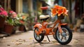 a small orange bike with flowers on the handlebars