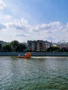 Small orange boat on the river