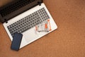 A small orange cart on the laptop keyboard, this image implies online shopping, that the customer order things from retail sites Royalty Free Stock Photo