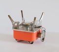 Small orange Gas camping stove on white Royalty Free Stock Photo