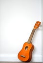 Small orange ukelele Royalty Free Stock Photo