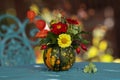 Small ornamental pumpkin decorated with flowers Royalty Free Stock Photo