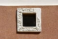 Small ornate ventilation window Royalty Free Stock Photo