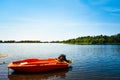 Motorboat moored on a lake on a warm summer day in England, UK