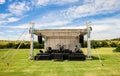 Small outdoor concert venue stage and lighting in a empty field Royalty Free Stock Photo