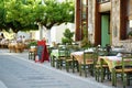 Small outdoor restaurants at the pedestrian area at center of Kalavryta town near the square and odontotos train station, Greece Royalty Free Stock Photo