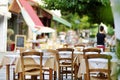 Small outdoor restaurants at the pedestrian area at center of Kalavryta town near the square and odontotos train station, Greece Royalty Free Stock Photo