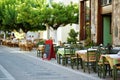Small outdoor restaurants at the pedestrian area at center of Kalavryta town near the square and odontotos train station, Greece Royalty Free Stock Photo