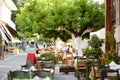 Small outdoor restaurants at the pedestrian area at center of Kalavryta town near the square and odontotos train station, Greece Royalty Free Stock Photo
