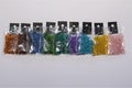 Small packs of colorful shiny silver lined glass beads Royalty Free Stock Photo