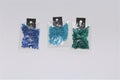 Small packs of different kind of blue colored shiny silver lined glass beads