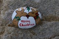Small painted rock with two reindeer kissing Royalty Free Stock Photo