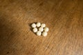 Small pale yellow tablets of probiotics Royalty Free Stock Photo