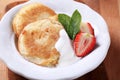 Small pancakes with cream and strawberry Royalty Free Stock Photo