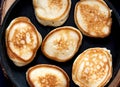 Small pancakes on a frying pan. Close up view