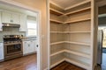 Panorama view of small pantry with empty shelves Royalty Free Stock Photo