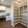 Panorama view of small pantry with empty shelves Royalty Free Stock Photo